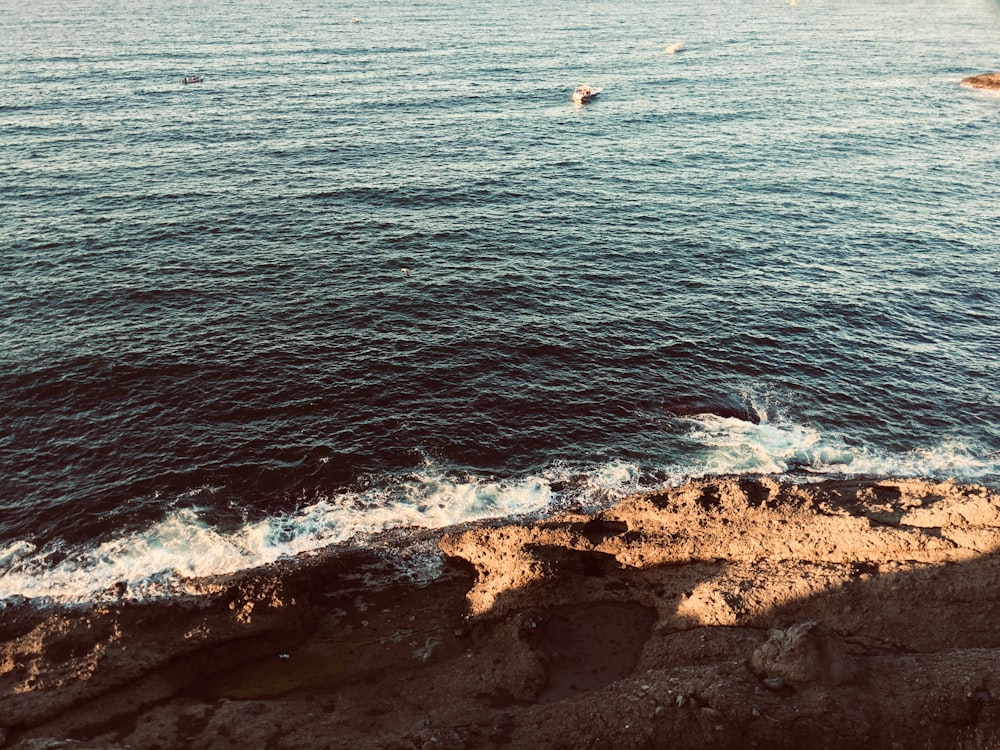 a view of a body of water from a cliff