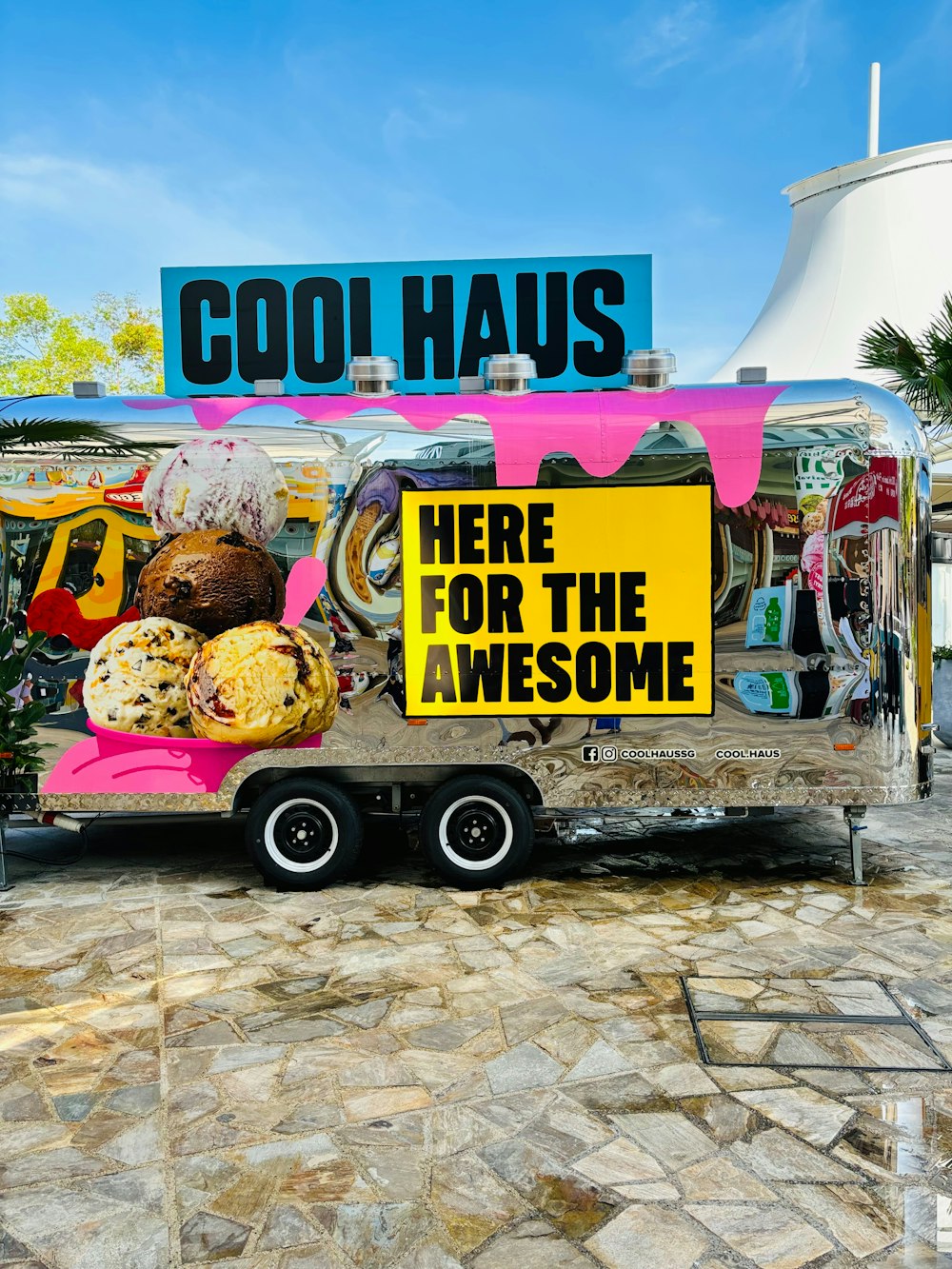a food truck with a sign that says cool haus here for the awesome