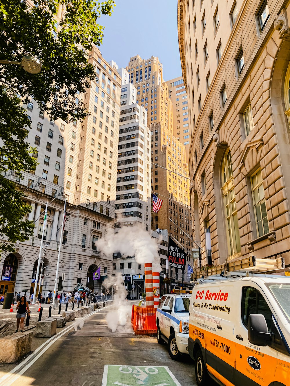 a city street filled with traffic and tall buildings