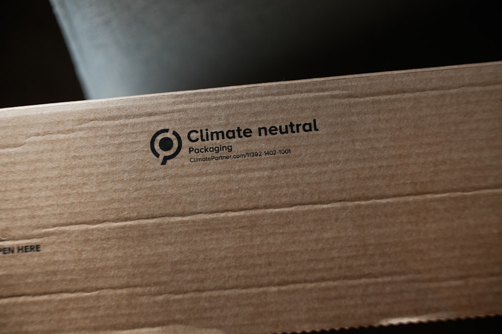 a cardboard box with a climate neutral logo on it
