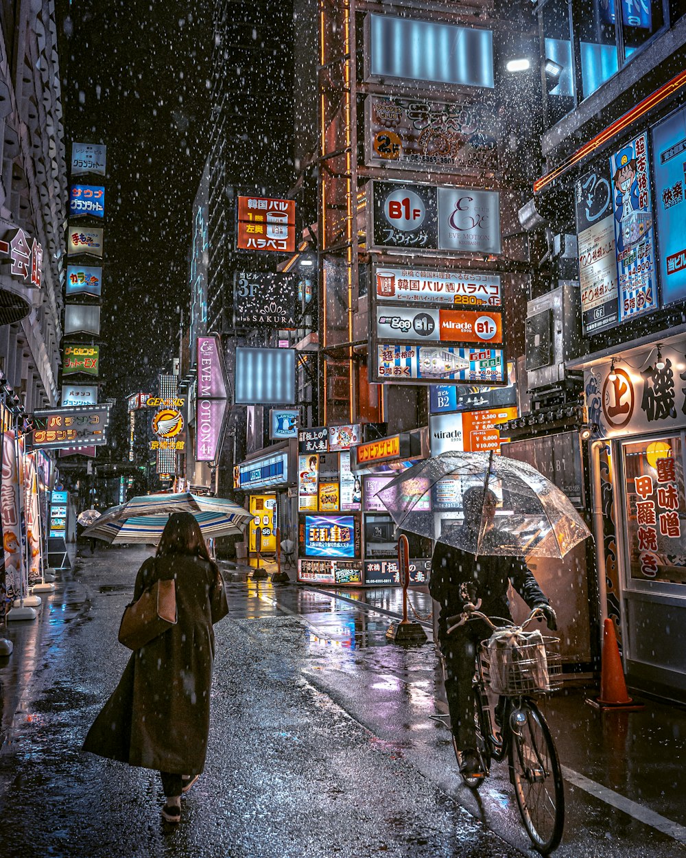 a woman walking down a street holding an umbrella