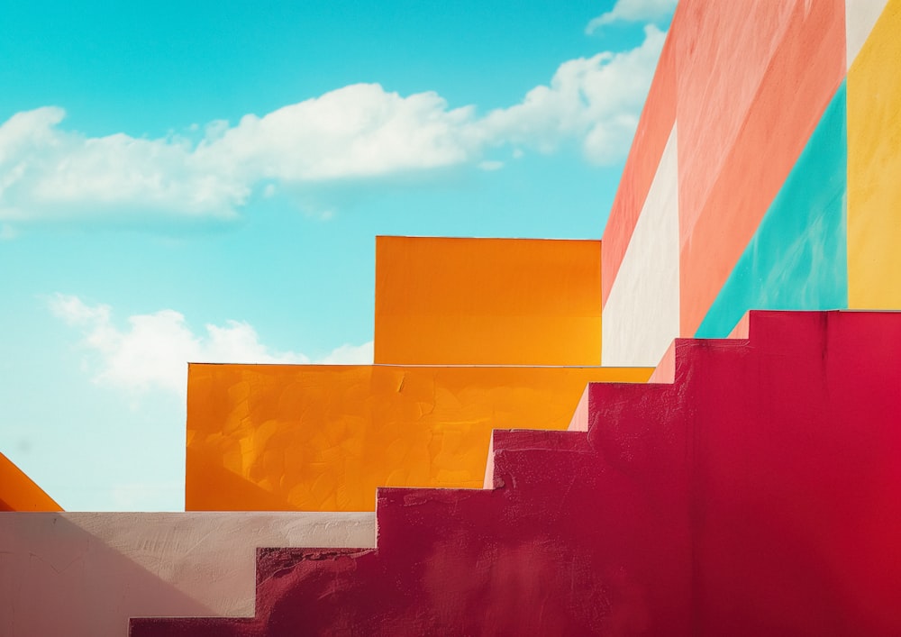 a bunch of different colored steps against a blue sky