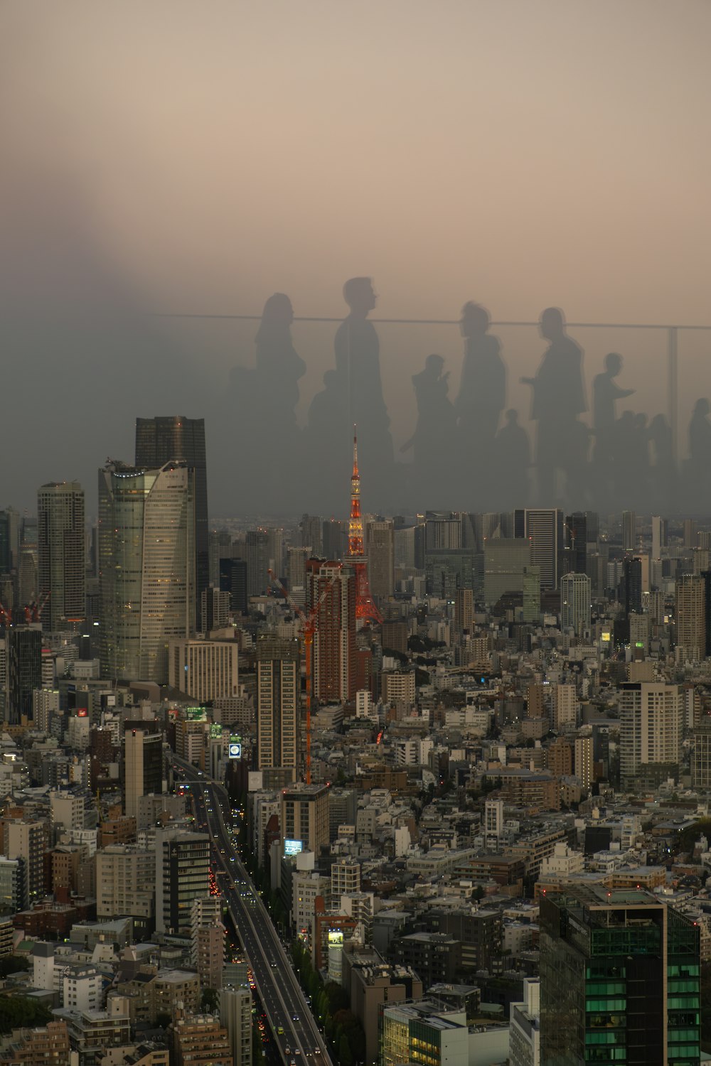 a group of people standing on top of a tall building