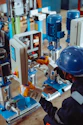 a man working on a machine in a factory