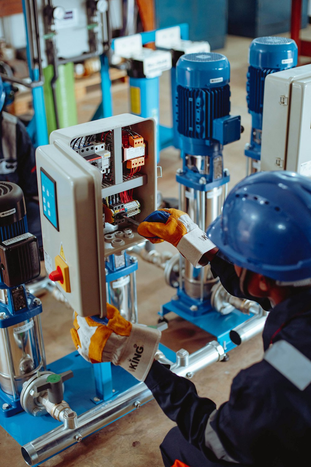 a man working on a machine in a factory