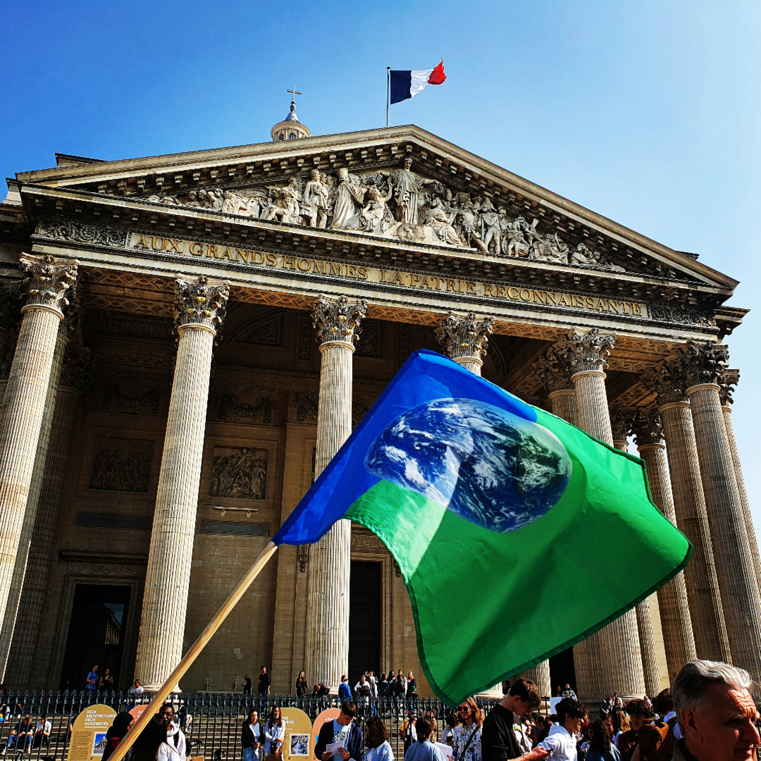 a group of people standing in front of a building