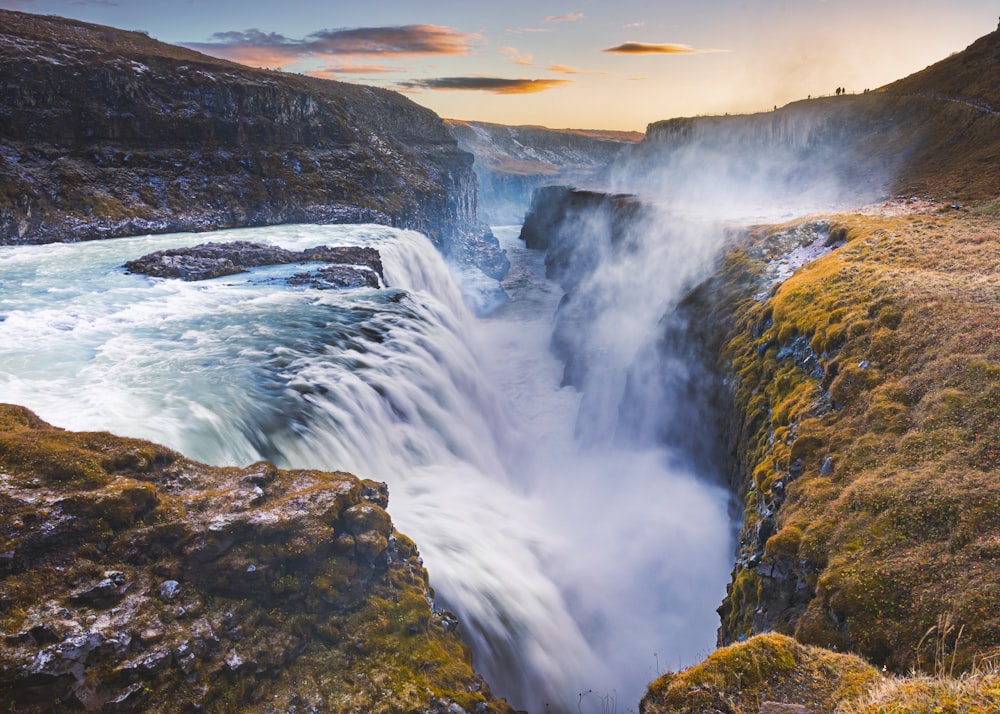 a large waterfall with water coming out of it