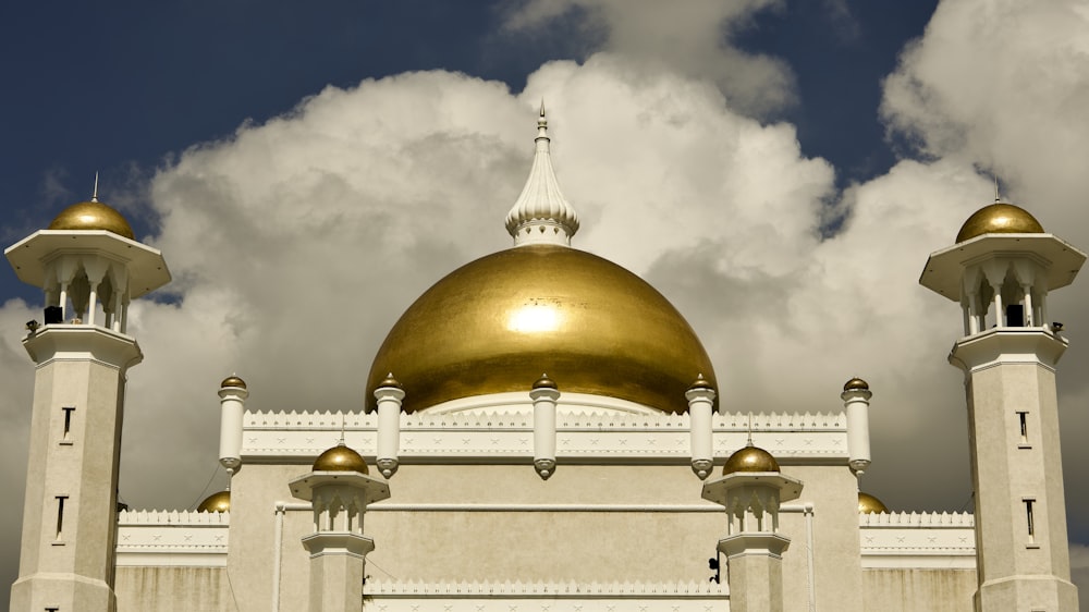 a large white building with a gold dome