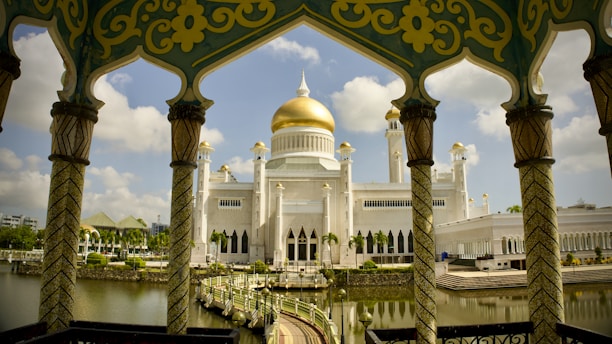 a large white building with a gold dome