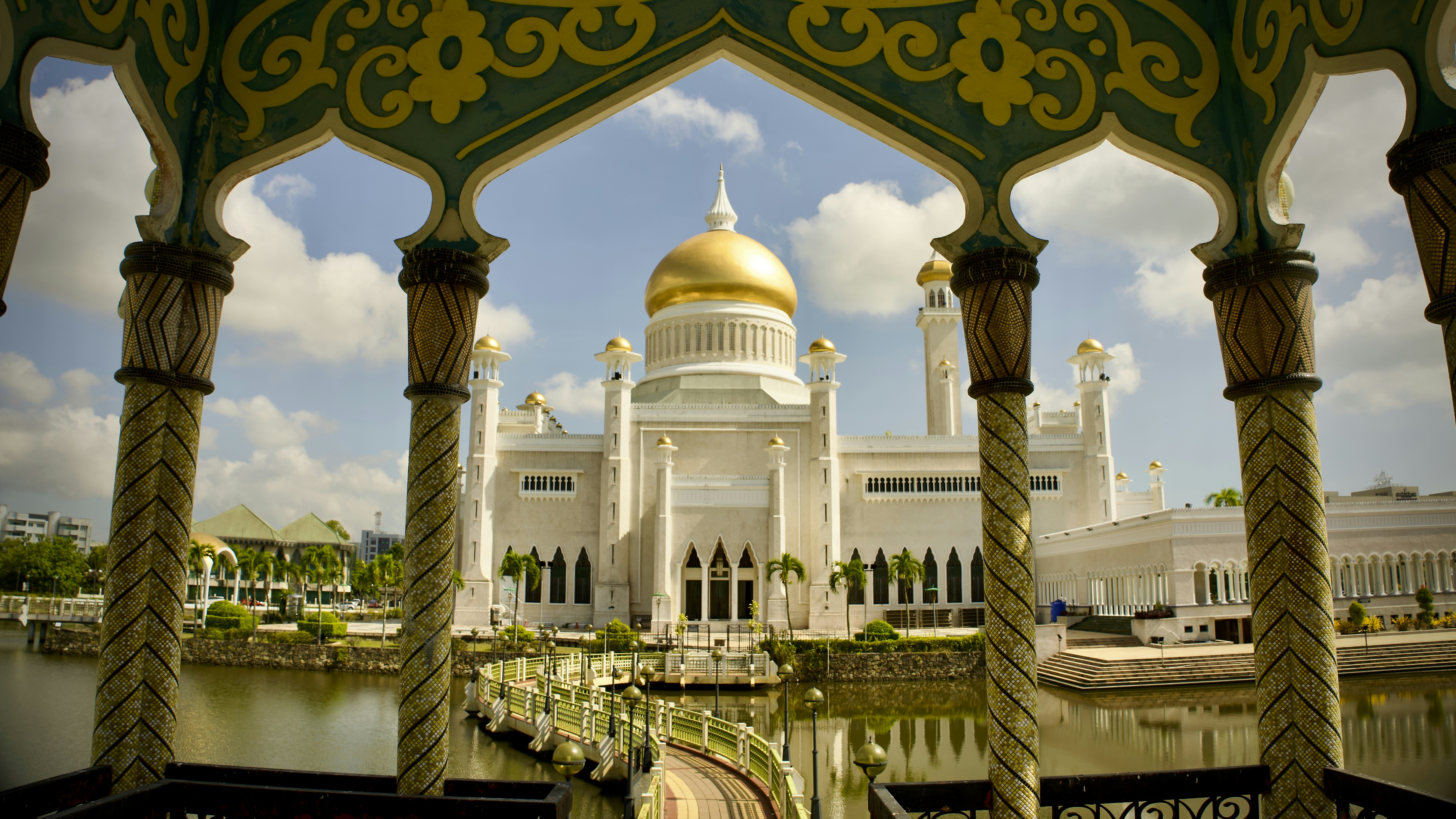 a large white building with a gold dome