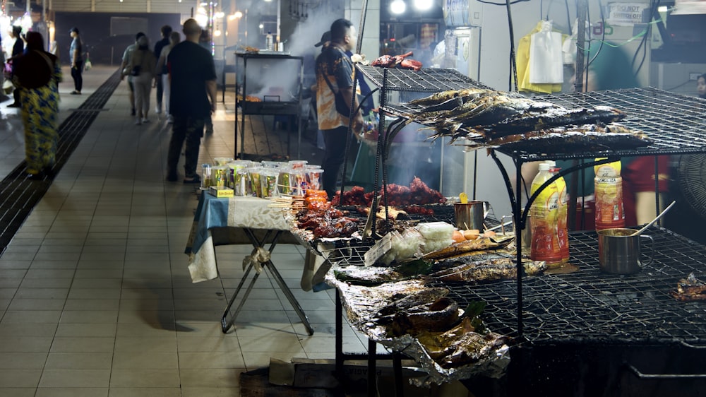 a bunch of food that is on a grill