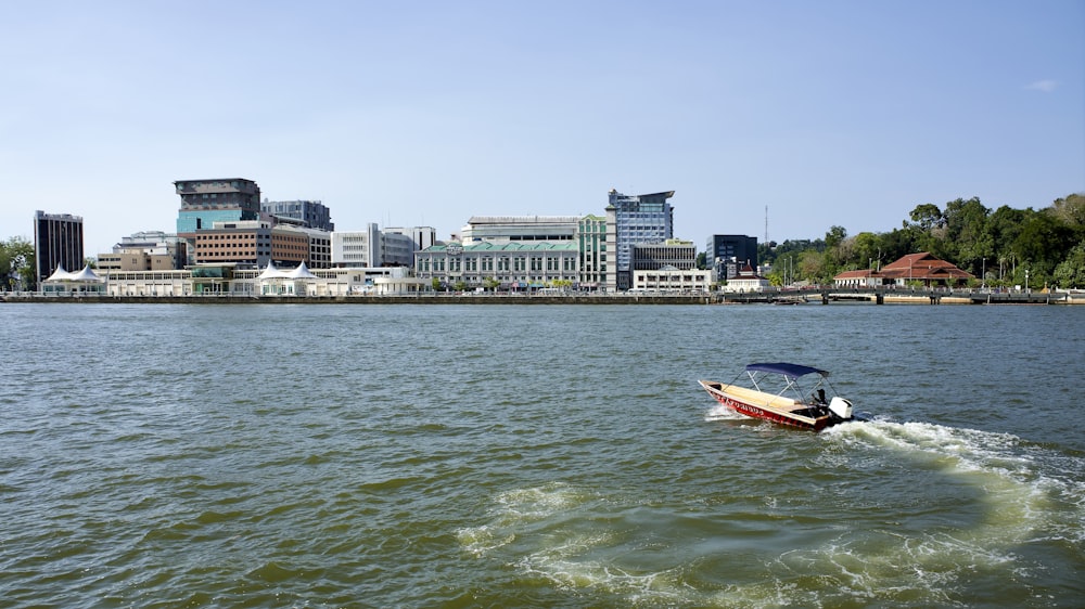 a small boat in the middle of a body of water