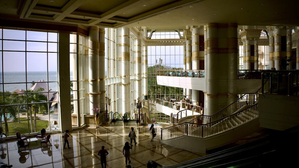 a group of people standing in a large building