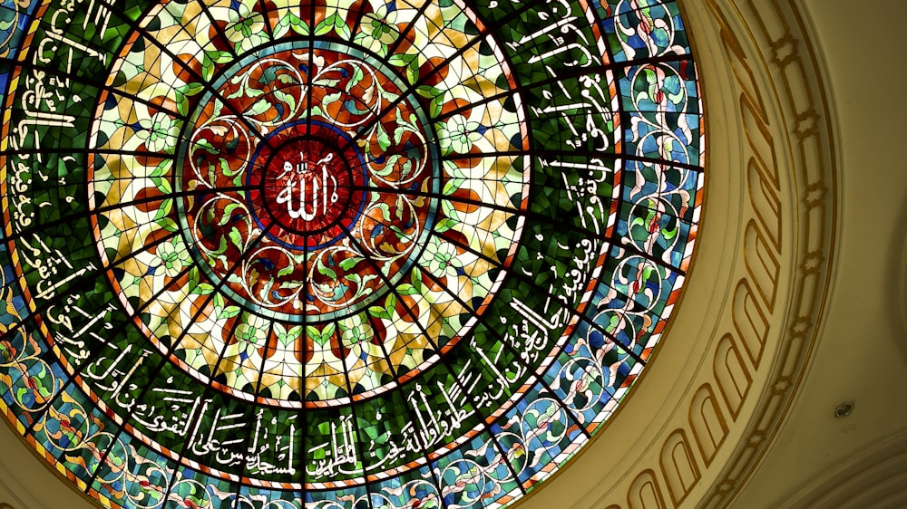a circular stained glass window in a building