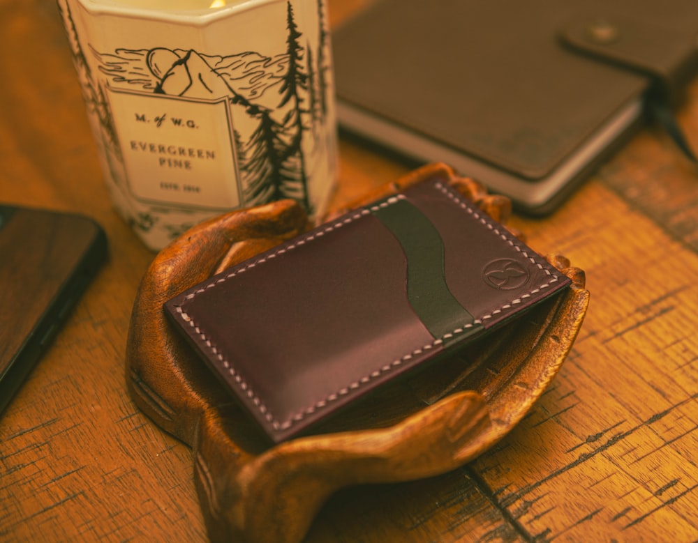 a wallet sitting on top of a wooden table