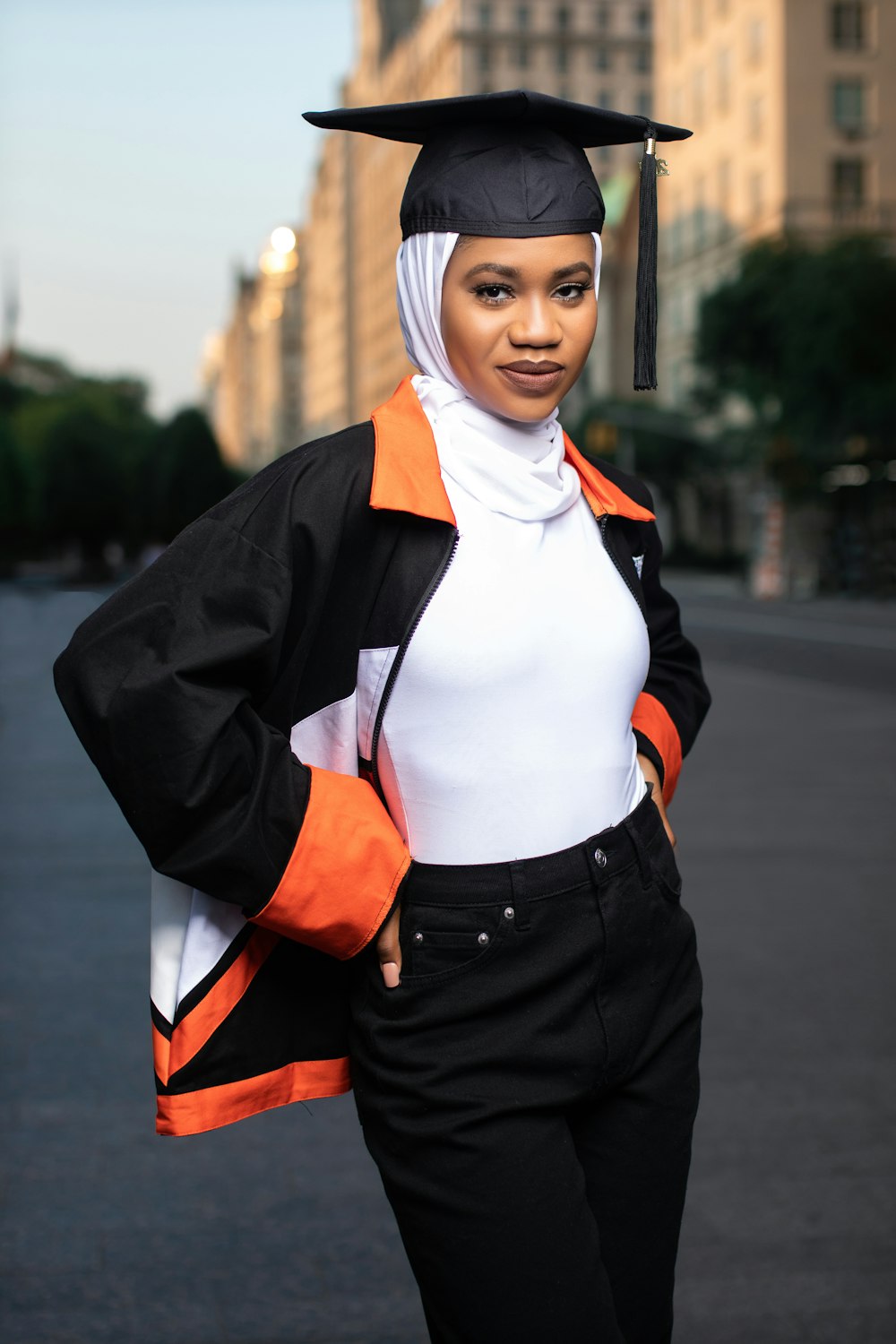 a woman in a graduation cap and gown