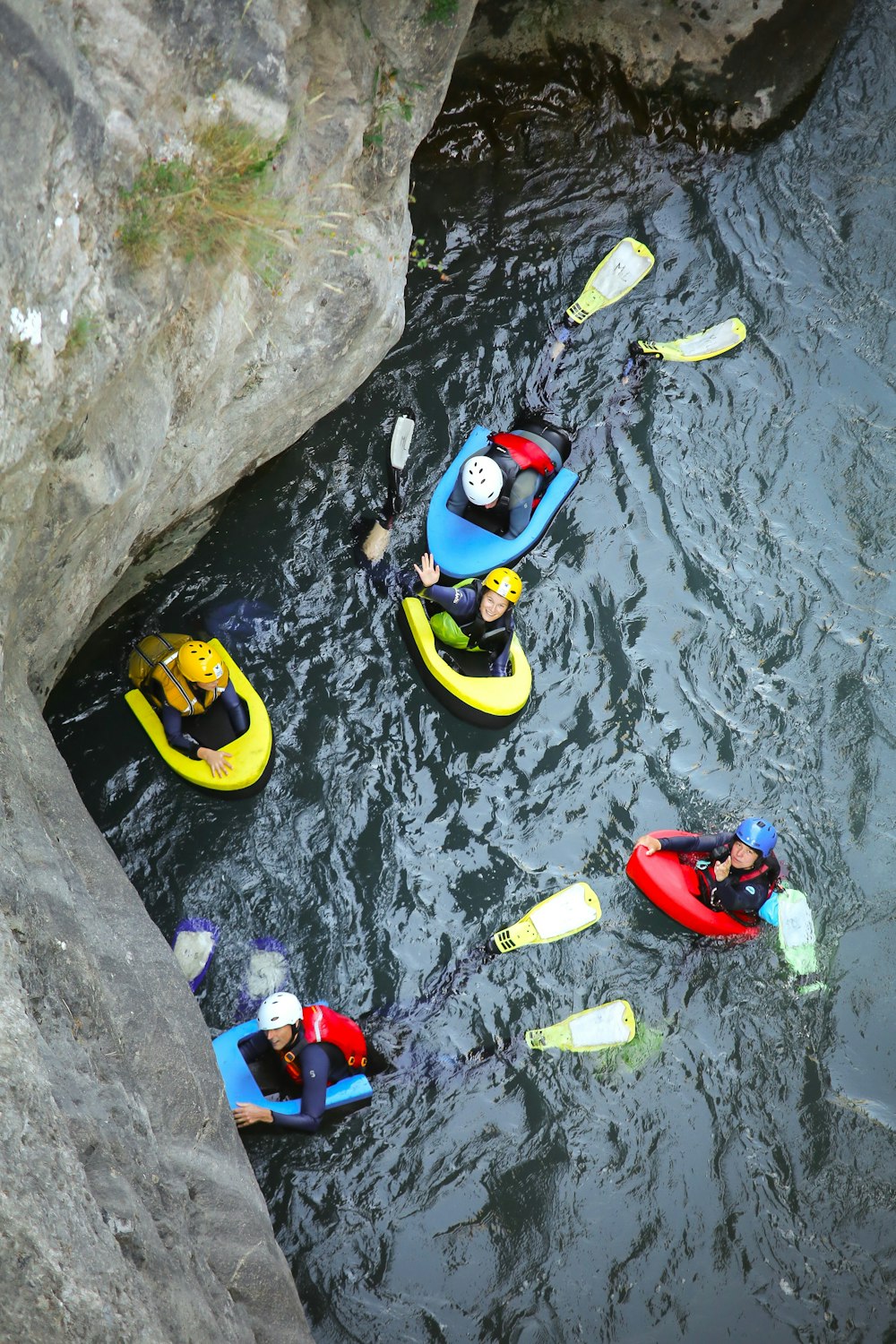 a group of people in kayaks on a body of water