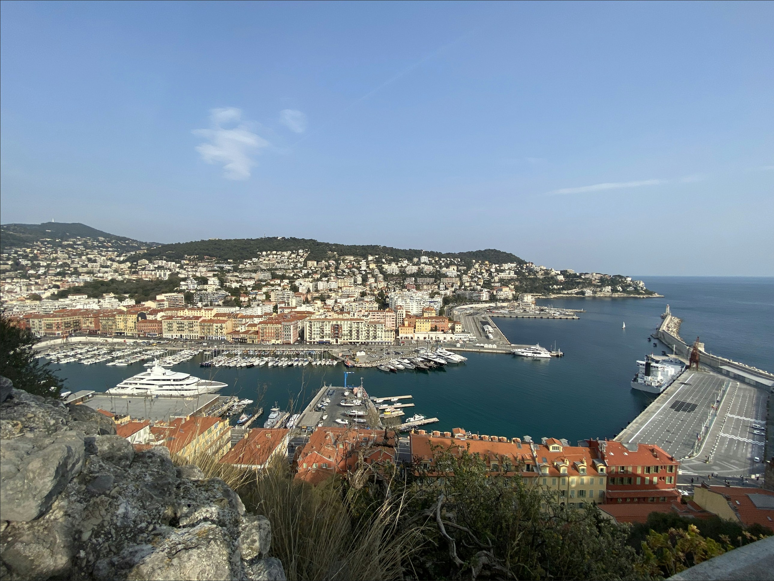 a view of a harbor with boats in the water
