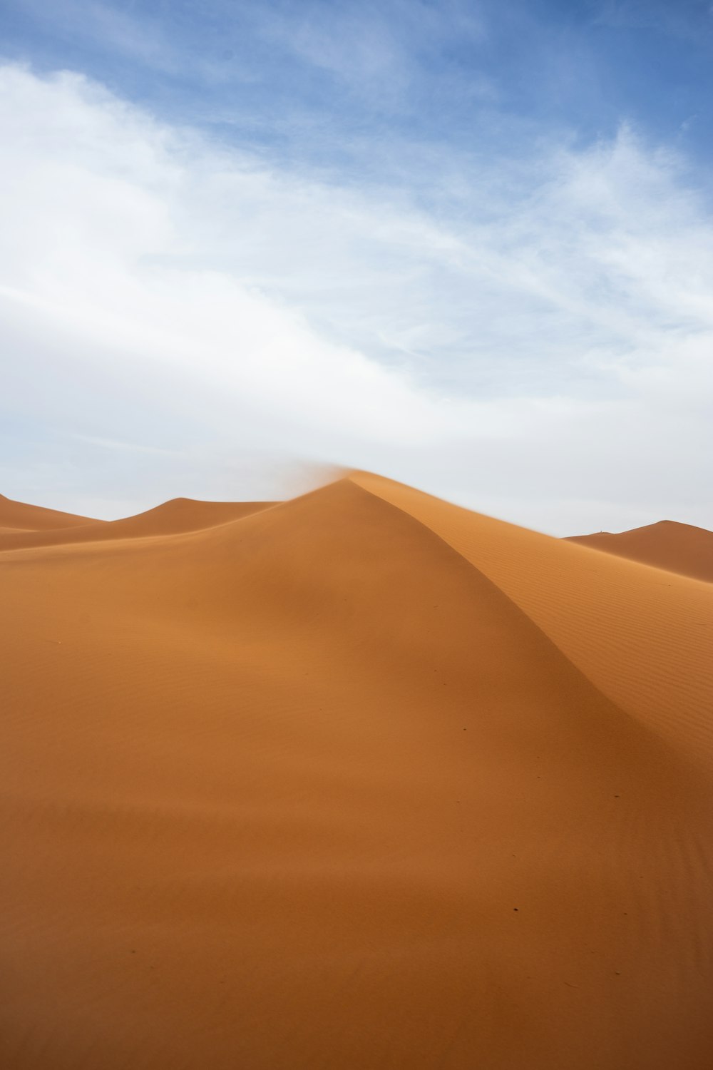 a large sand dune in the middle of a desert