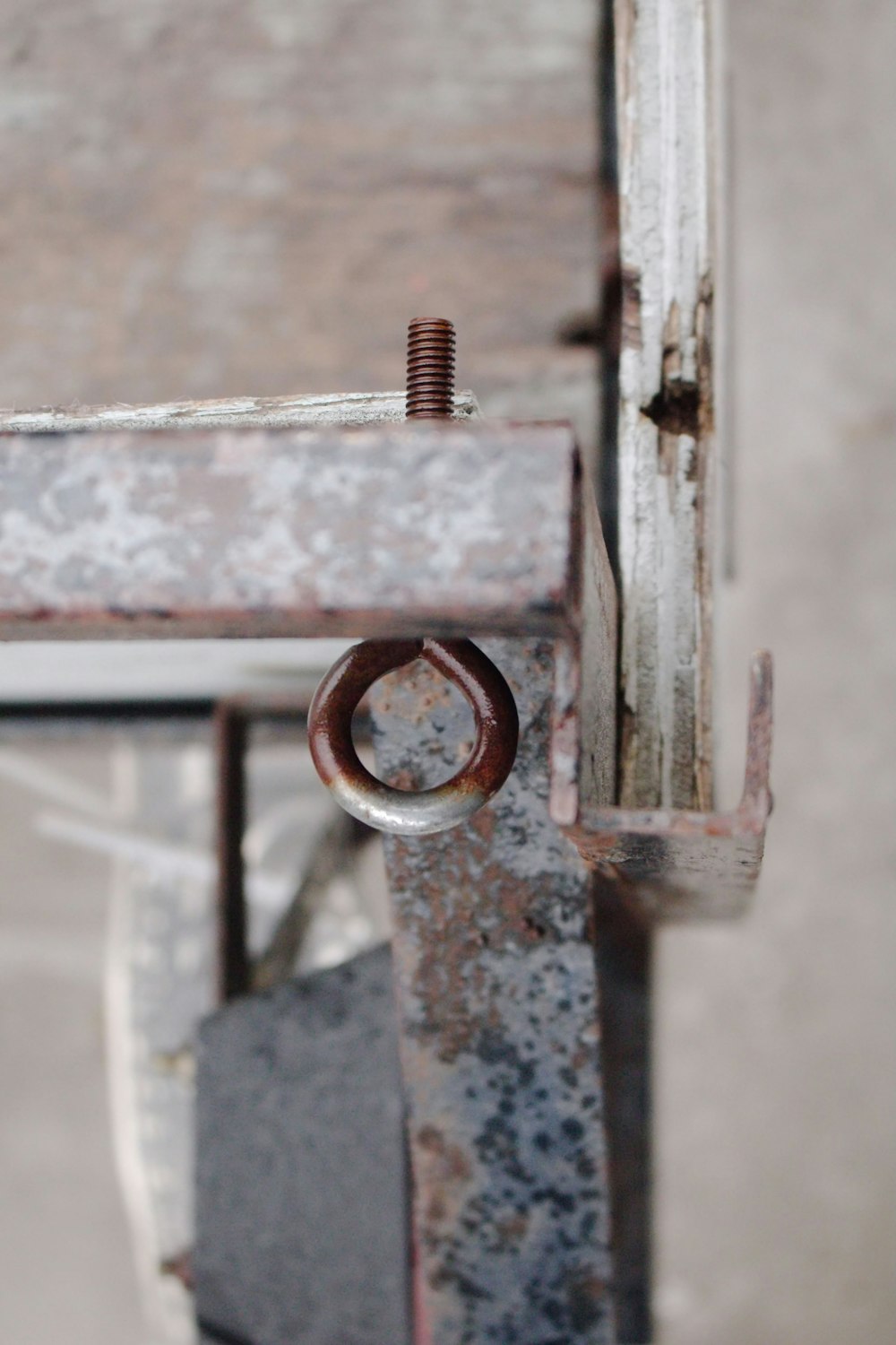 a close up of a piece of metal with a ring on it