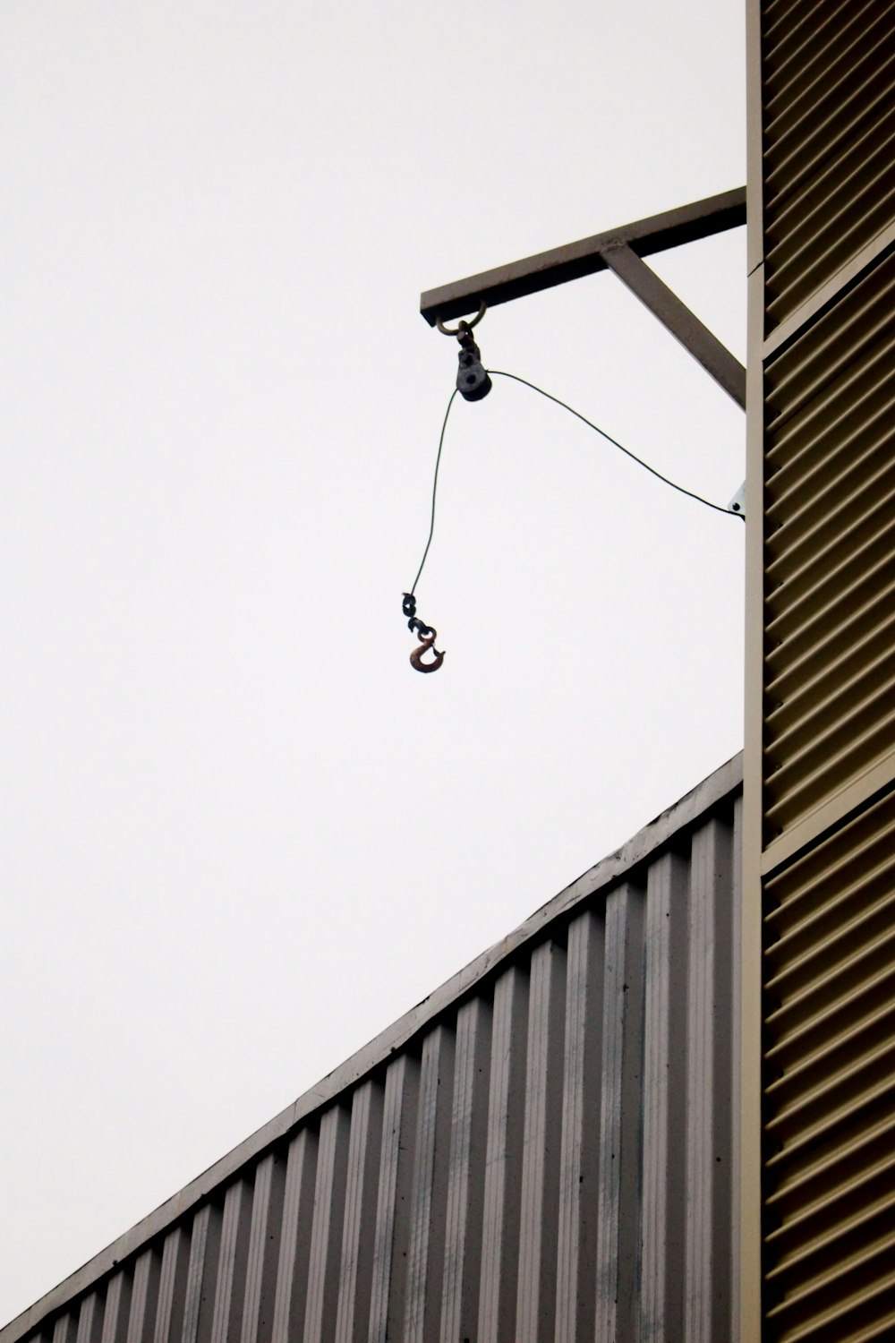 a street light hanging from the side of a building