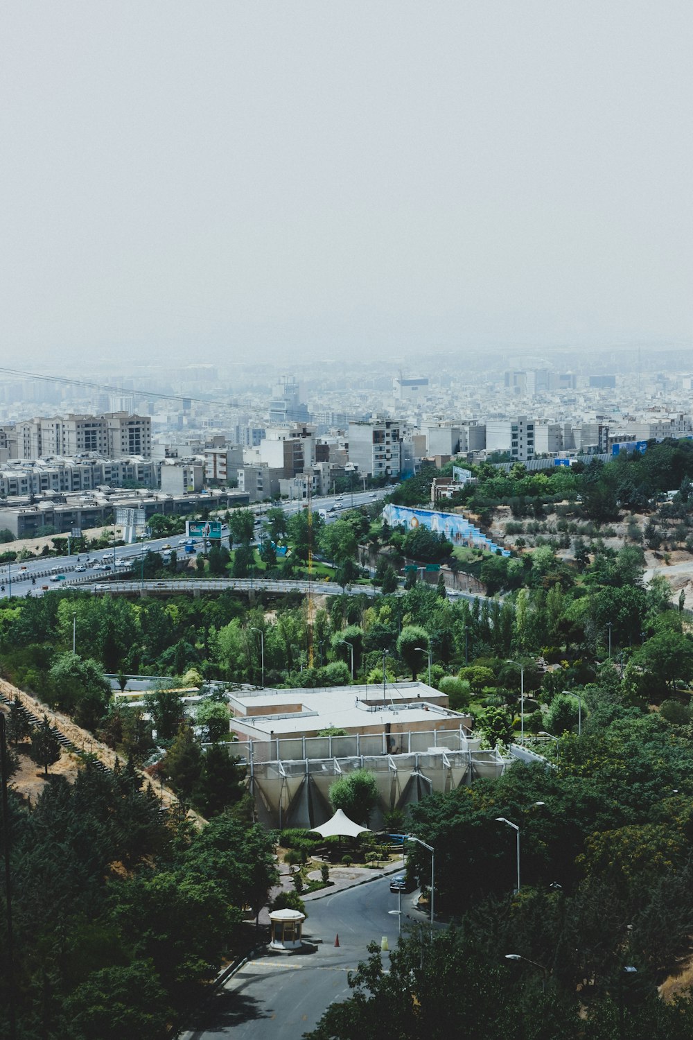 a view of a city from the top of a hill