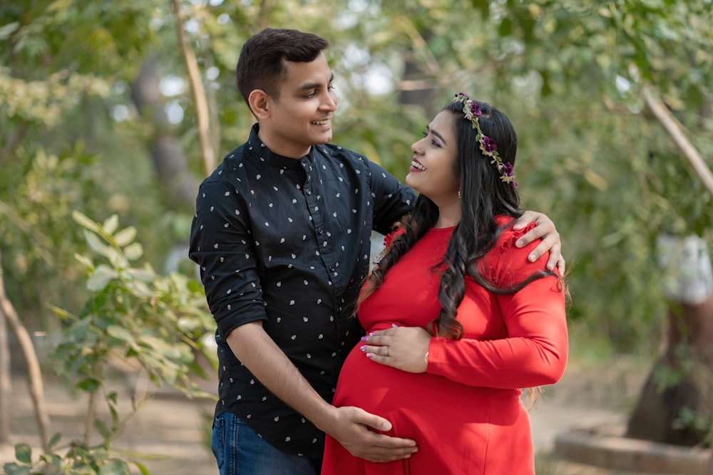 a man and a woman standing next to each other