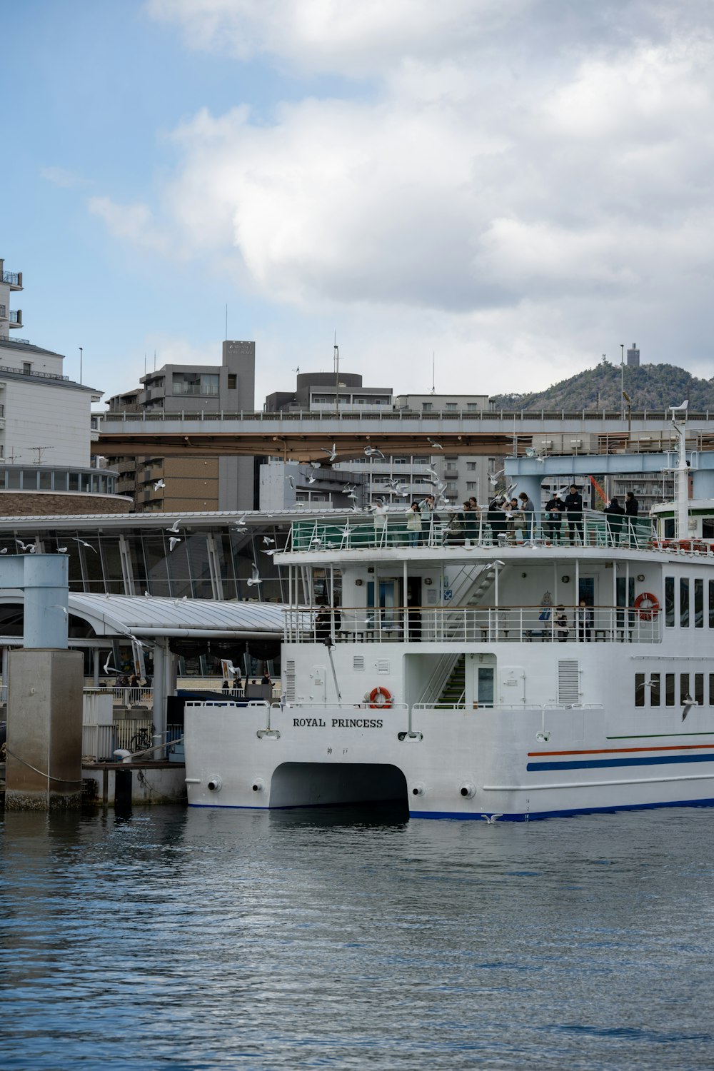 a large white boat floating on top of a body of water