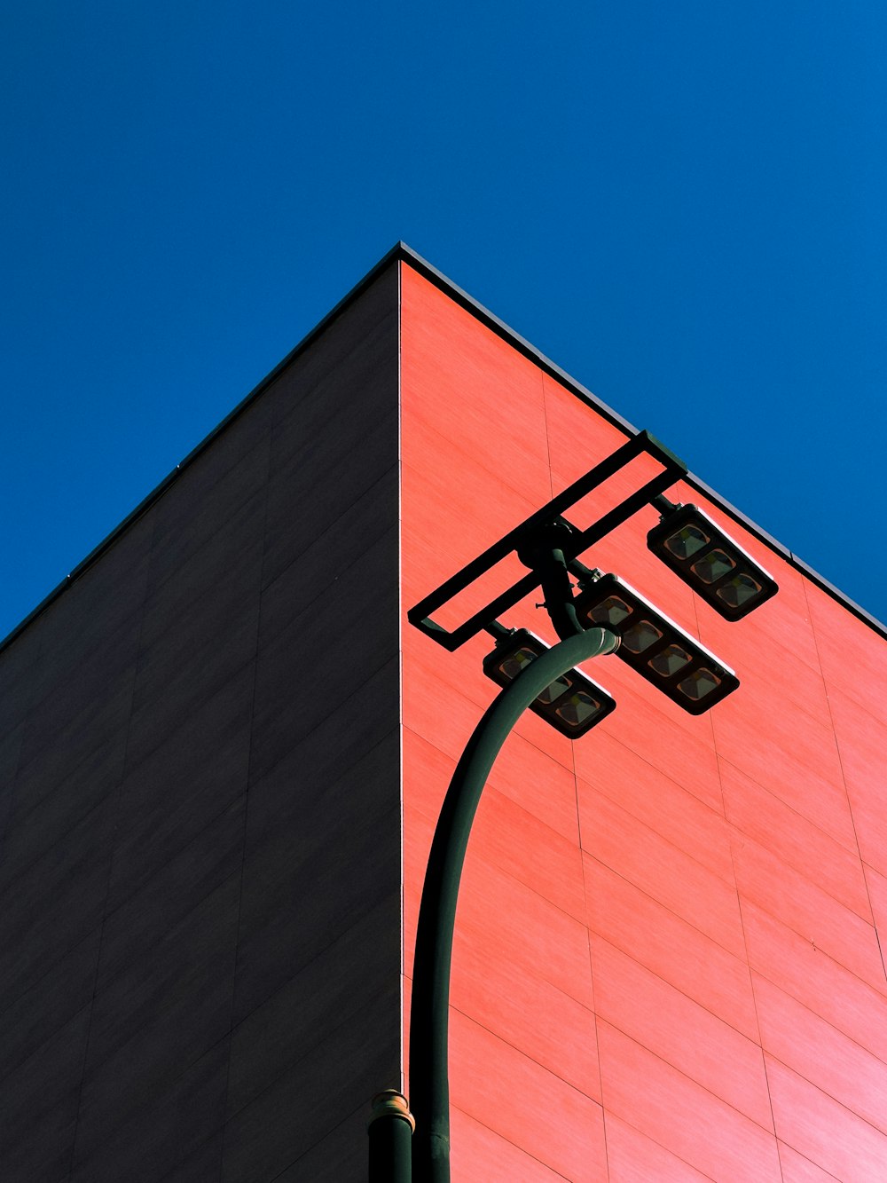 a street light next to a tall building
