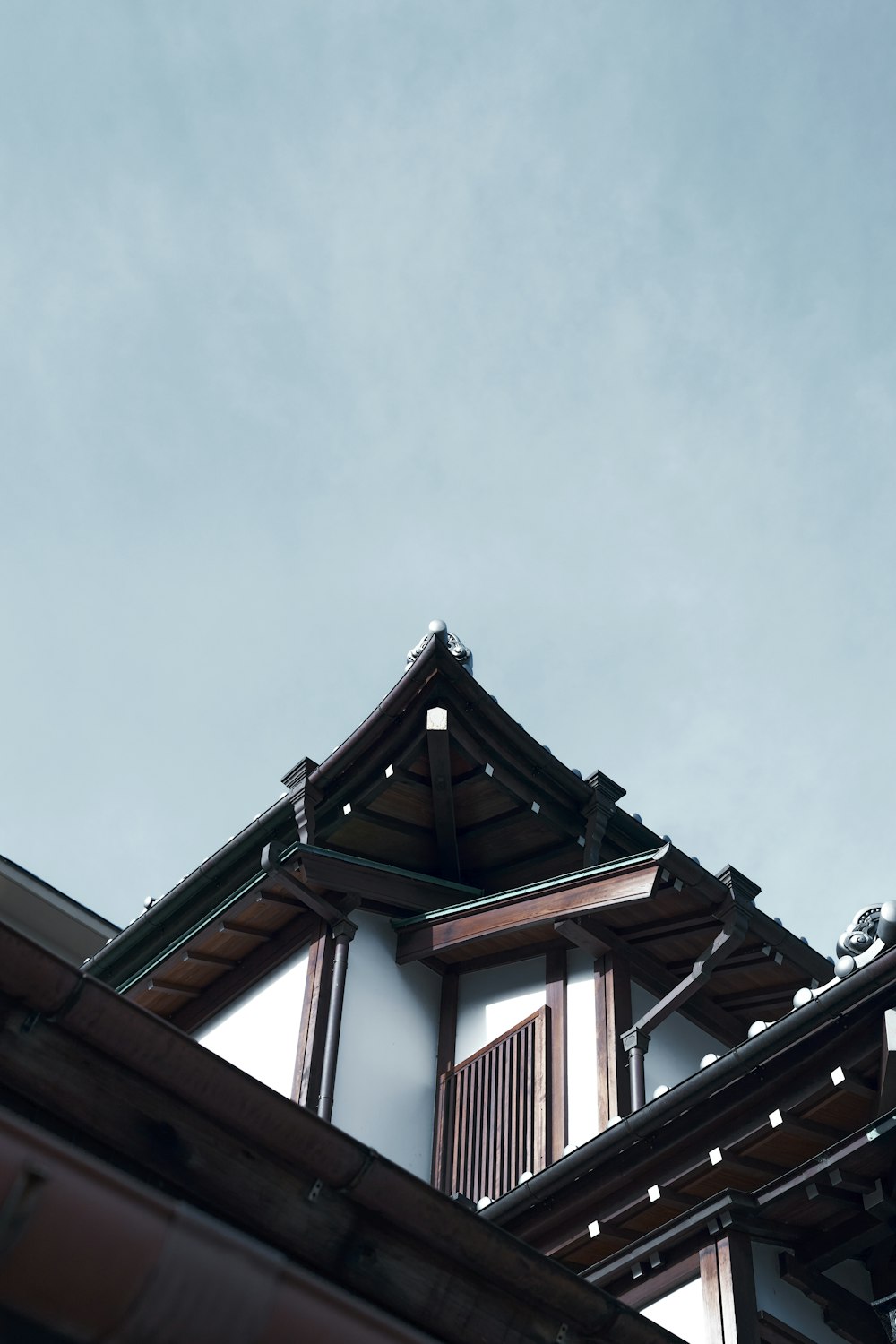 the roof of a building with a clock on it