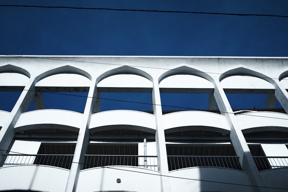 a tall white building with lots of windows