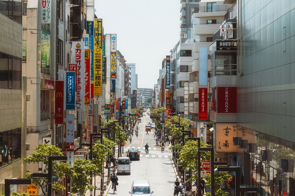 a city street filled with lots of tall buildings