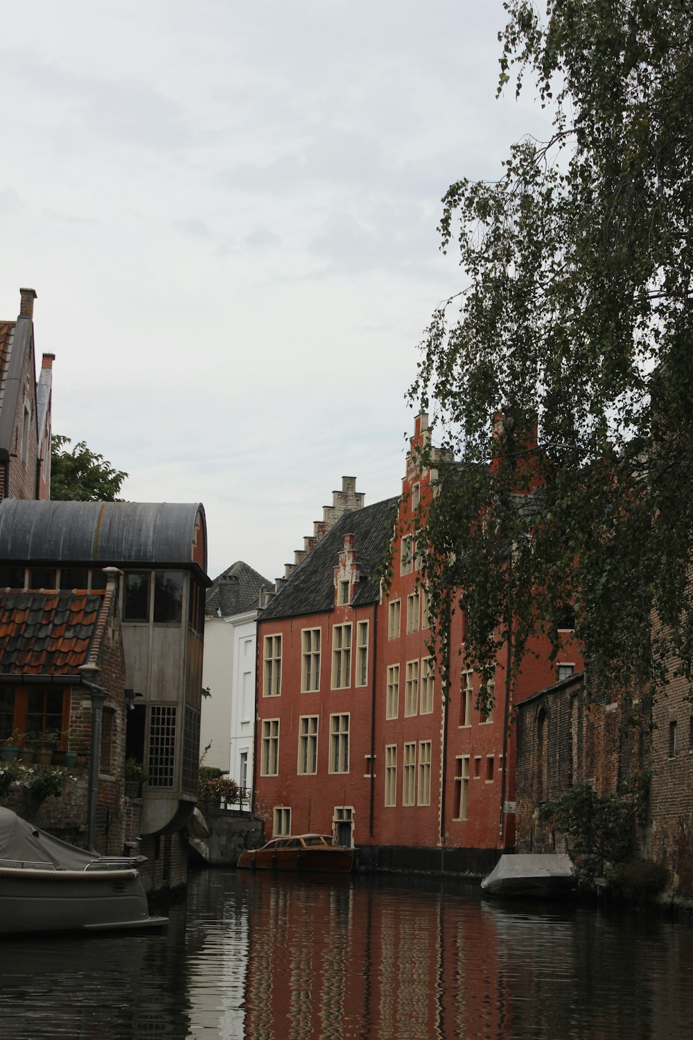 a body of water next to a row of buildings