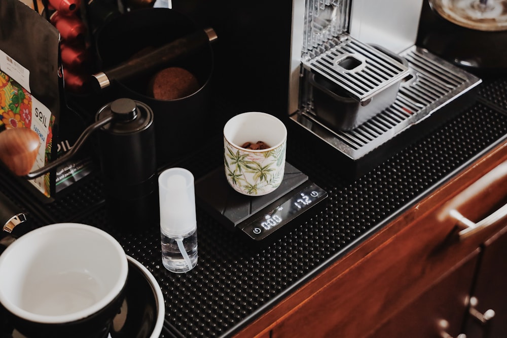 a cup of coffee sitting on top of a counter