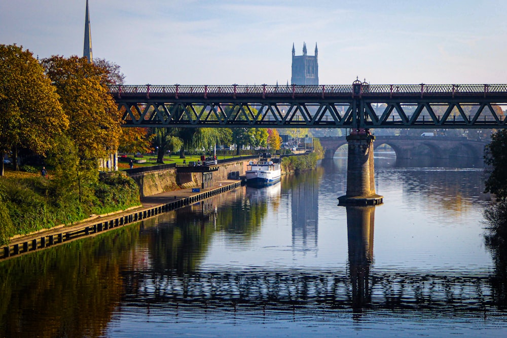 a bridge over a river with boats on it