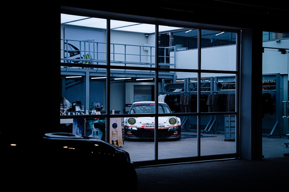 a car parked inside of a garage next to a window