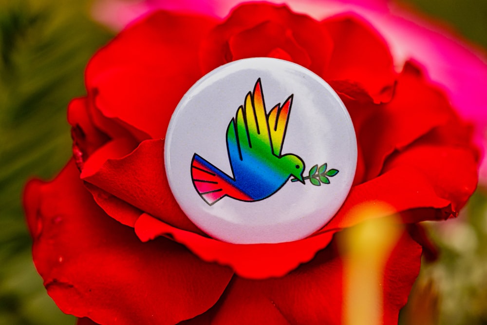 a close up of a flower with a bird on it