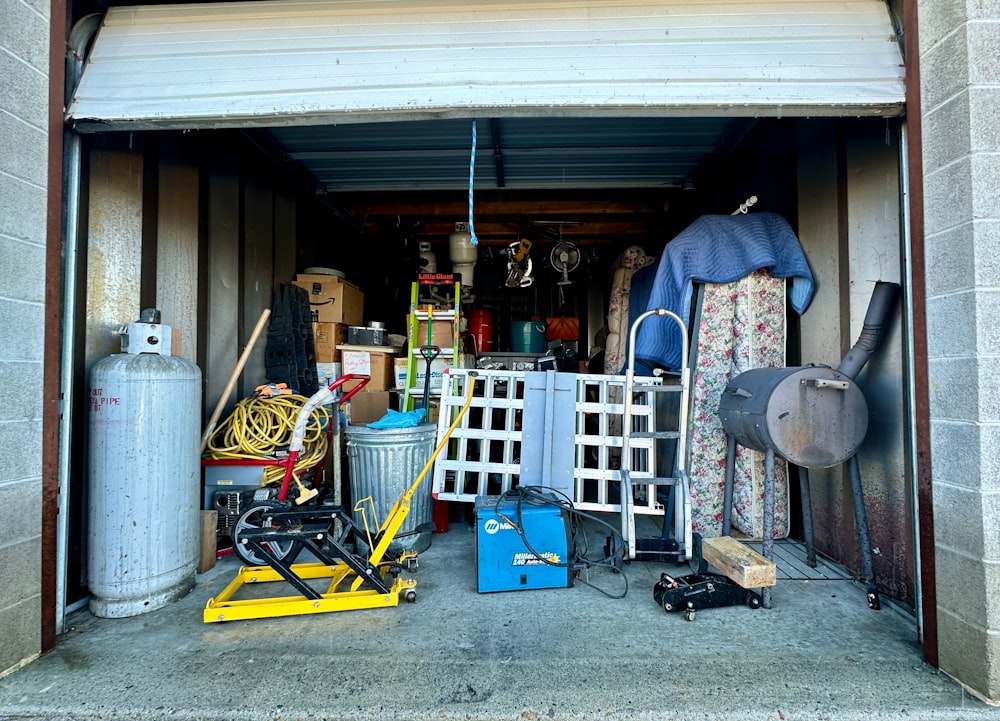 a garage filled with lots of clutter and tools