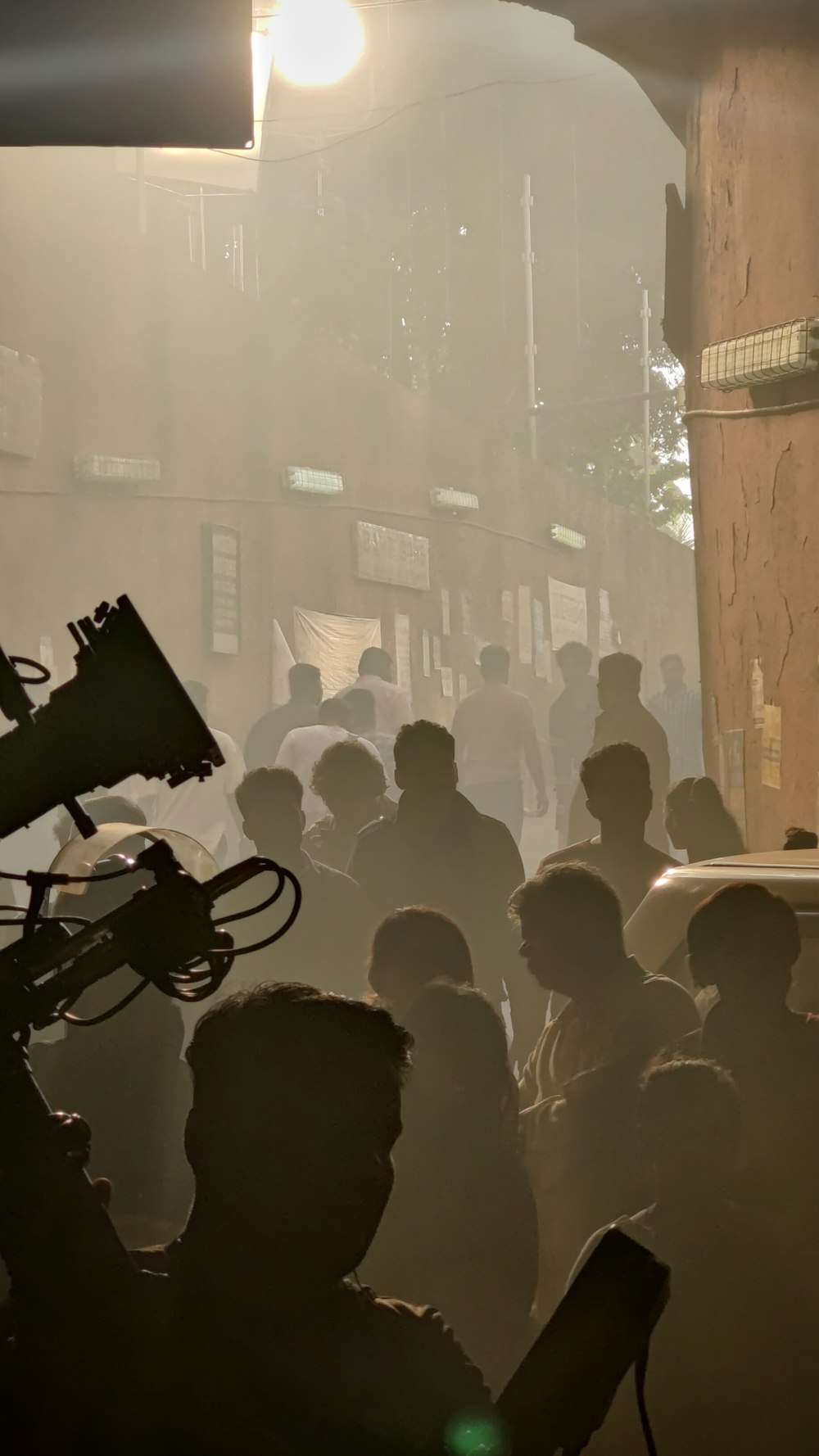 a crowd of people standing around a building