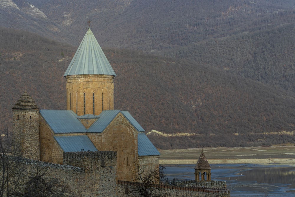 a large building with a steeple and a blue roof