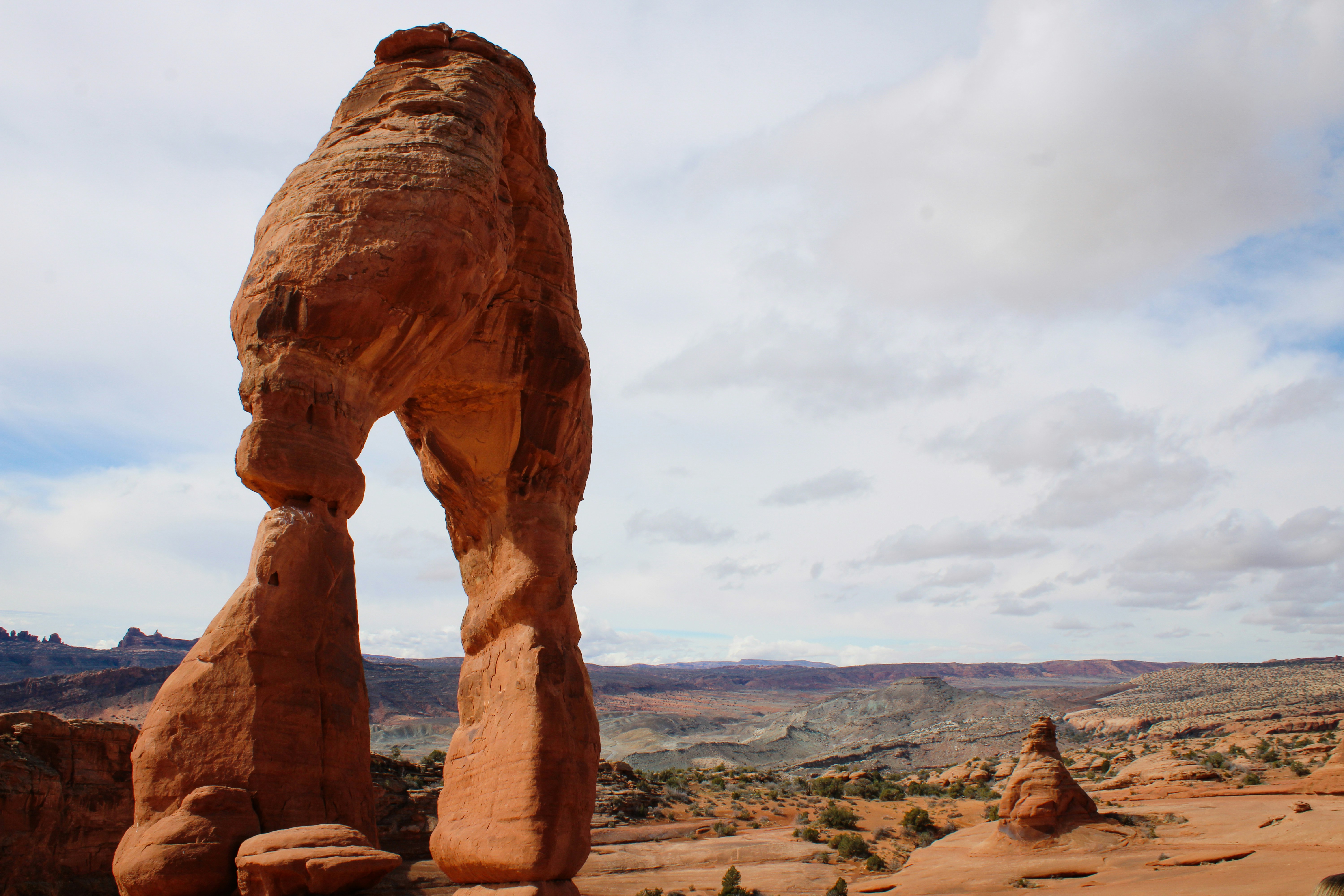 a large rock formation in the middle of a desert