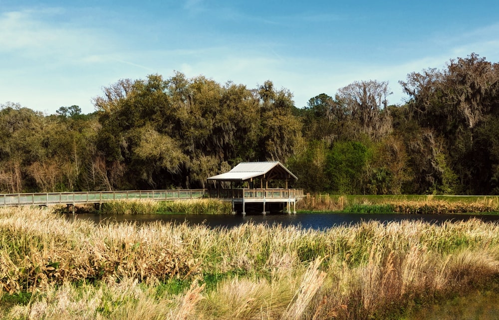 a house sitting on top of a bridge over a river