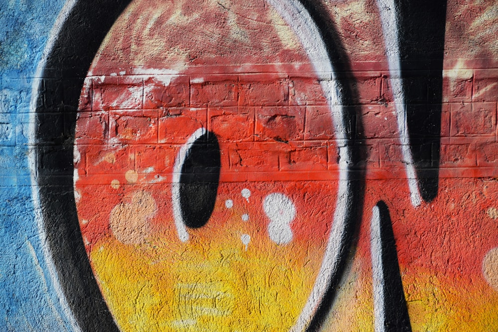 a close up of graffiti on a brick wall