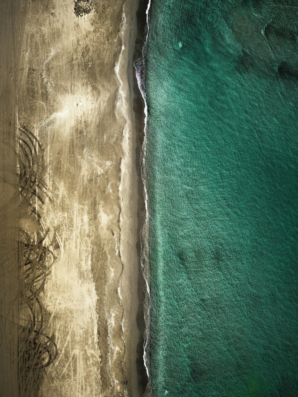 an aerial view of a beach and ocean