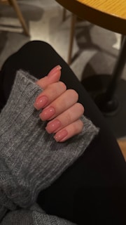 a woman's hand with a manicure on it
