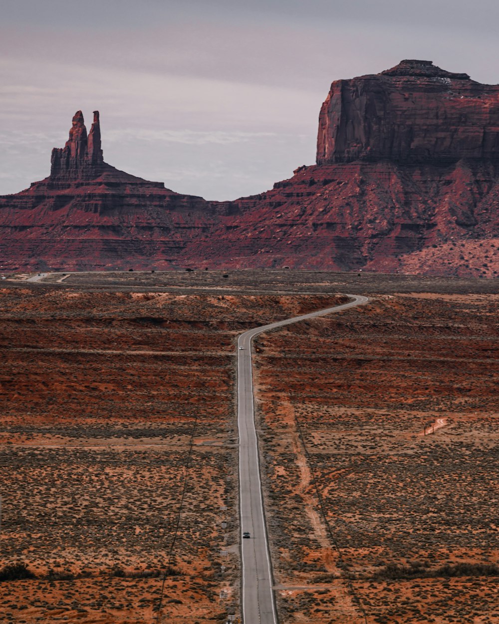 a long road in the middle of a desert