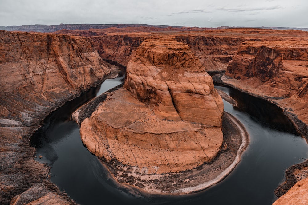 a river running through a canyon surrounded by mountains