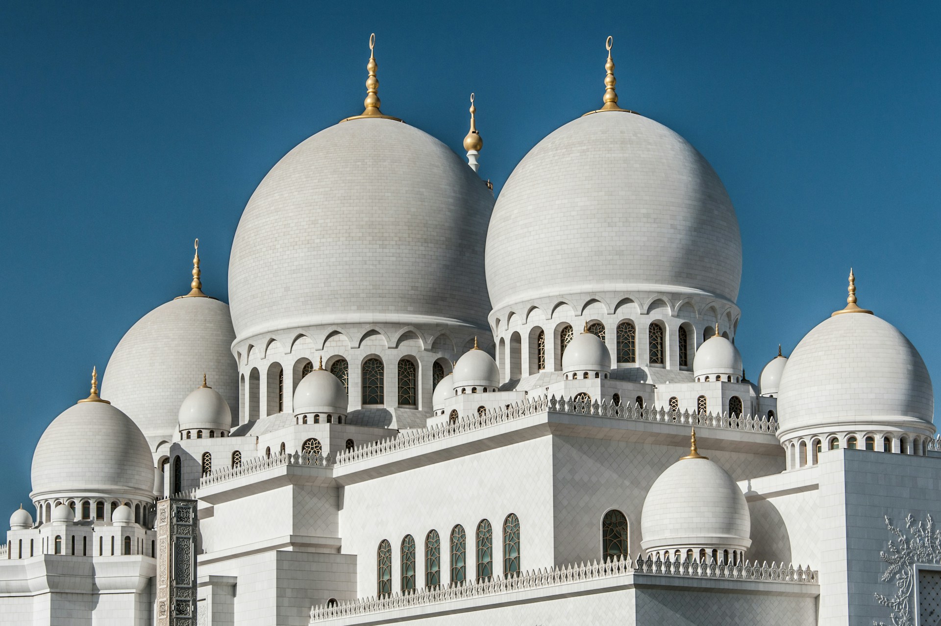 a large white building with a clock on it's side
