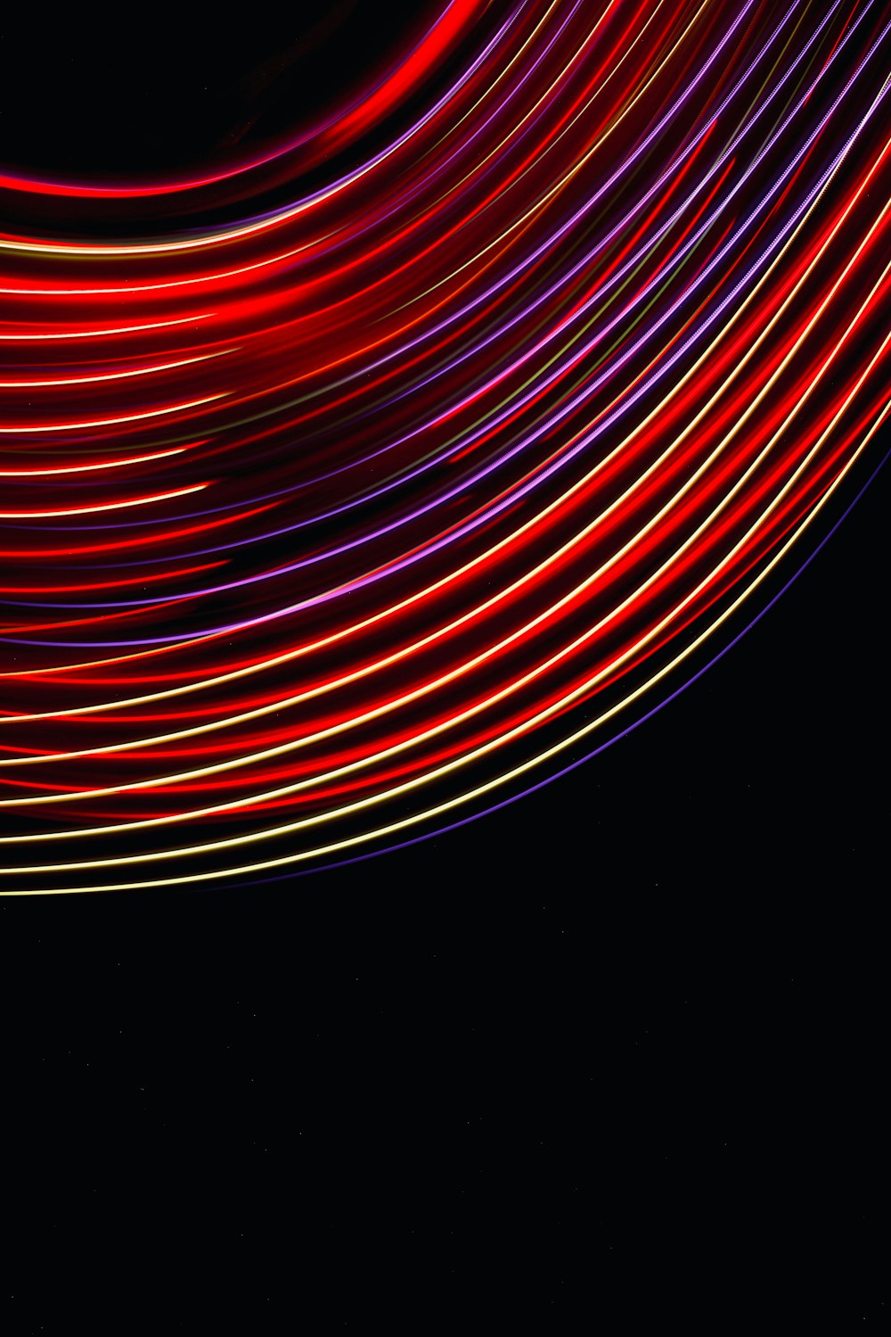 a black background with red and purple lines