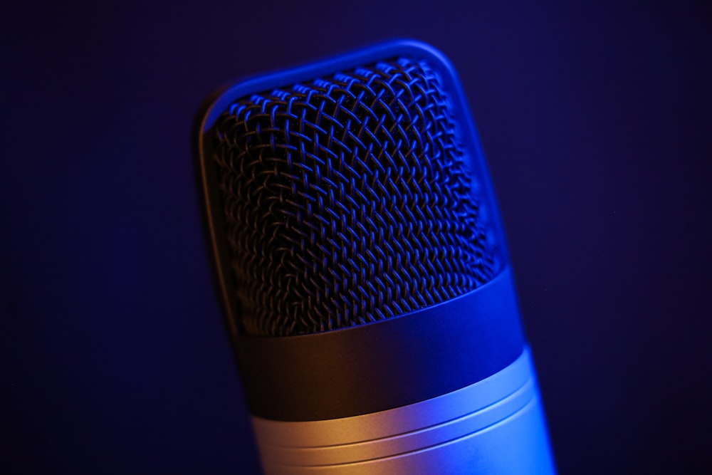 a close up of a microphone in a dark room